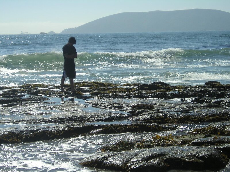Person Standing on Rocks