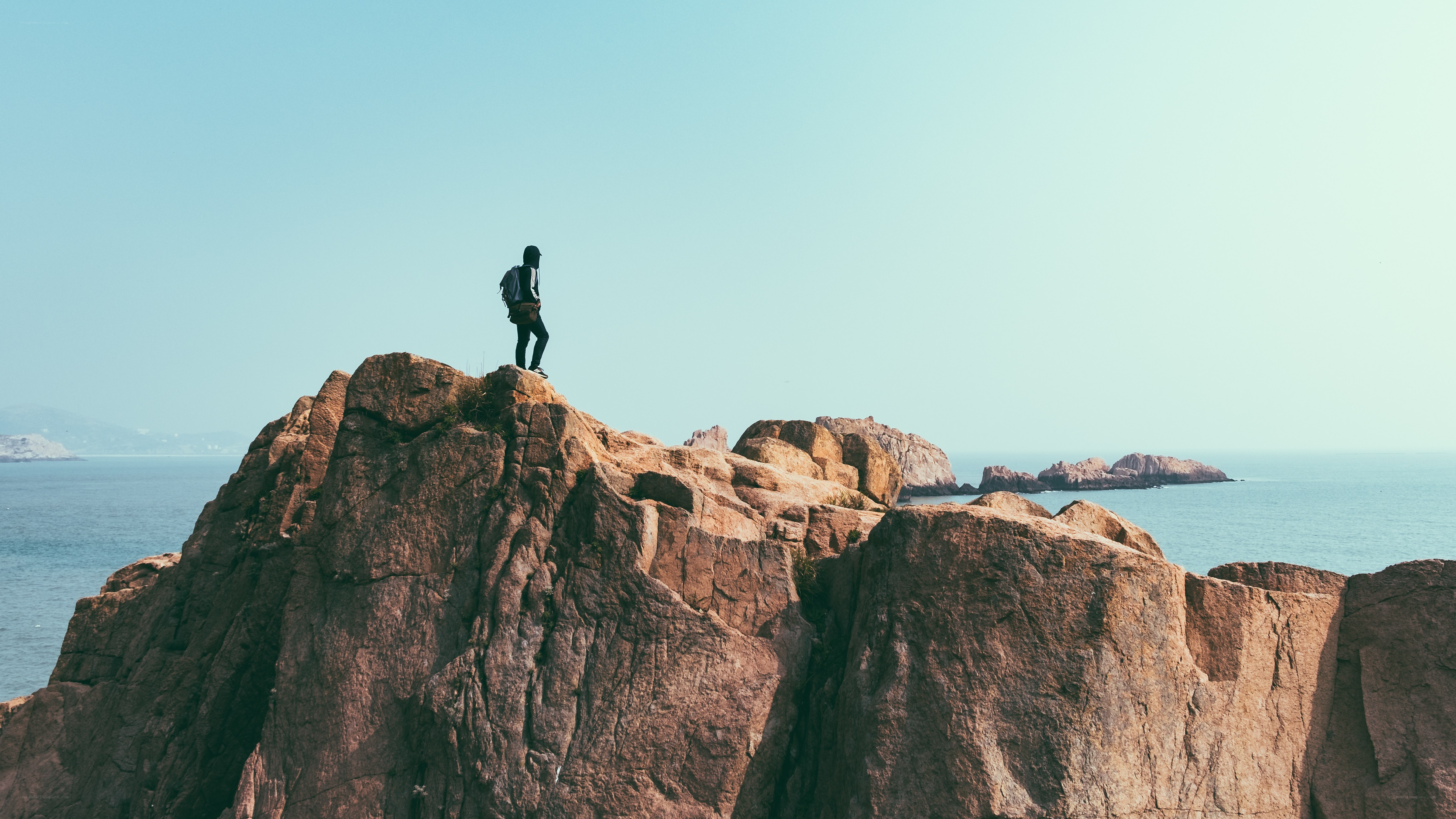 person standing on rocky cliff