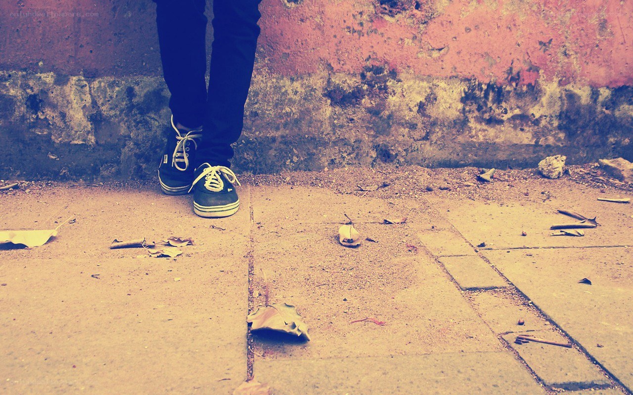 person standing on sidewalk