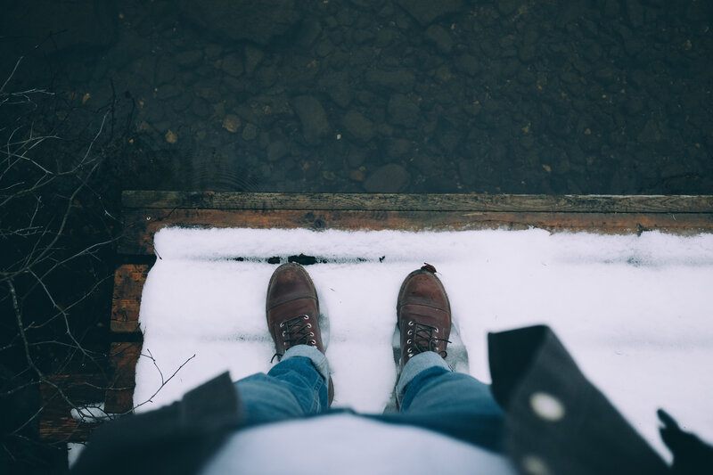 person standing on snowy dock