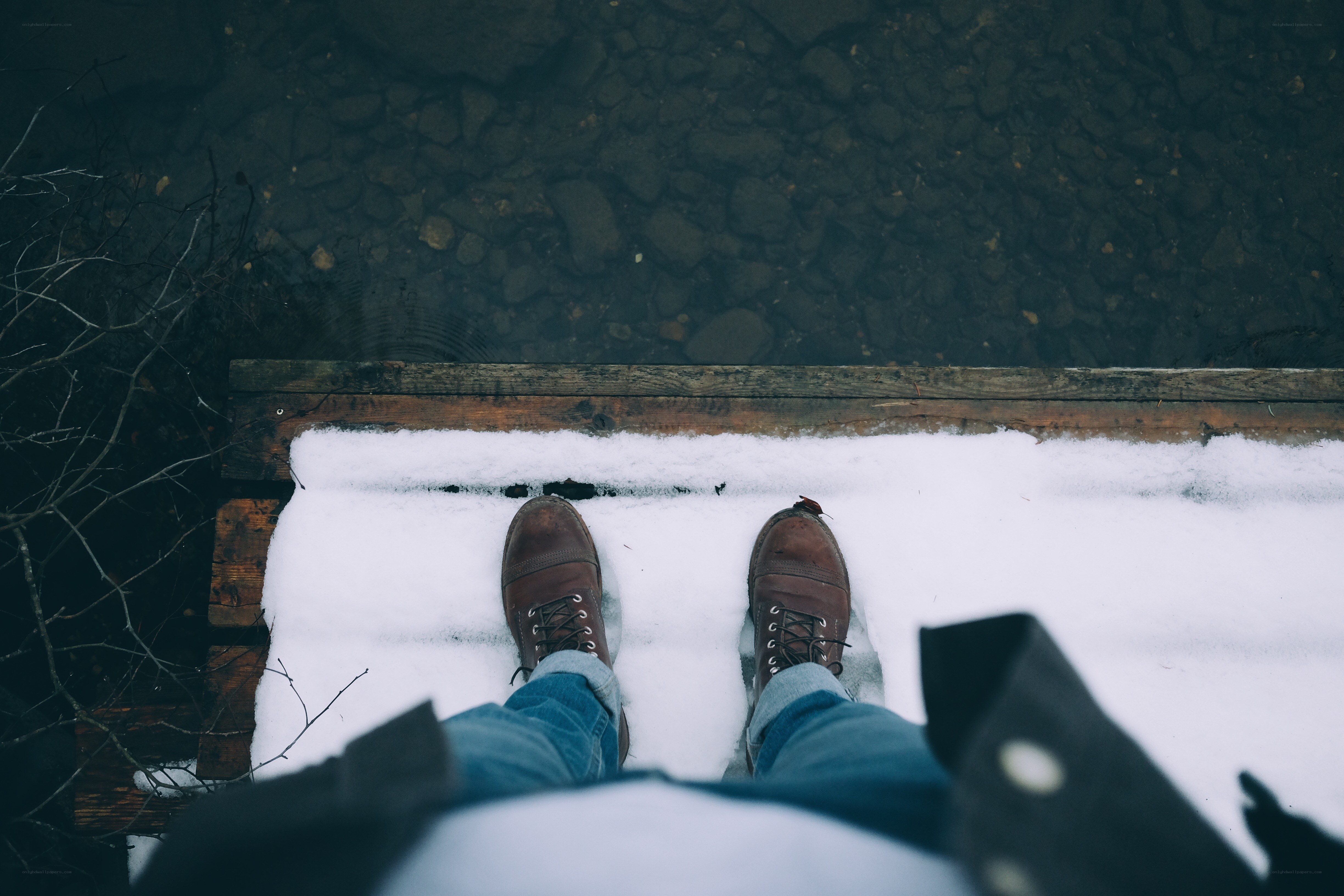 person standing on snowy dock