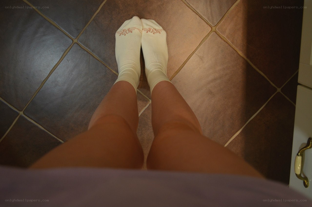 person standing on tiled floor
