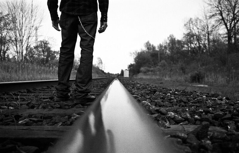Person standing on train tracks