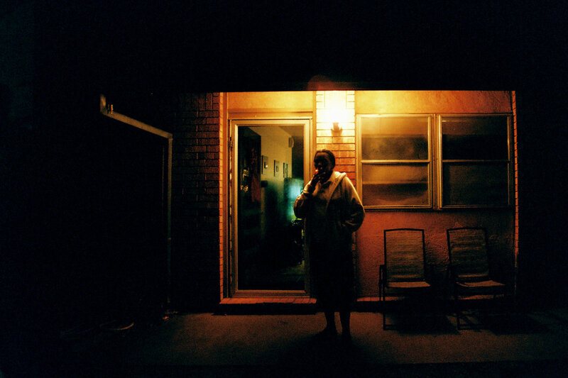 Person Standing Outside at Night