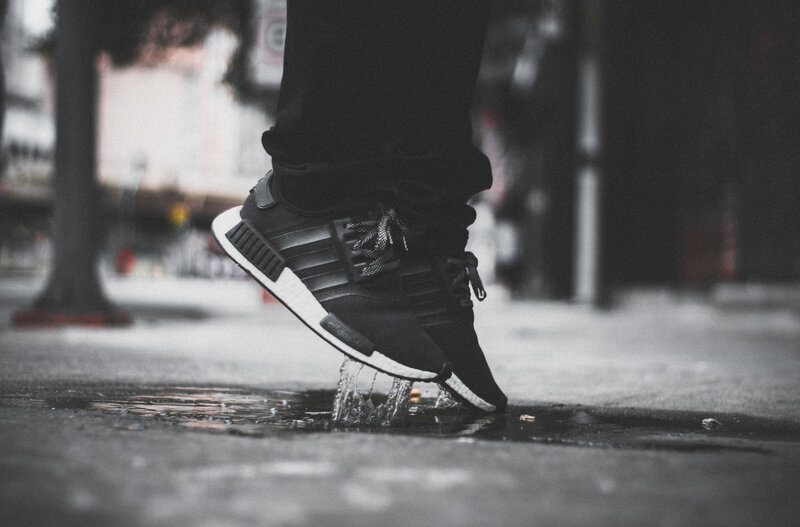 person stepping in a puddle