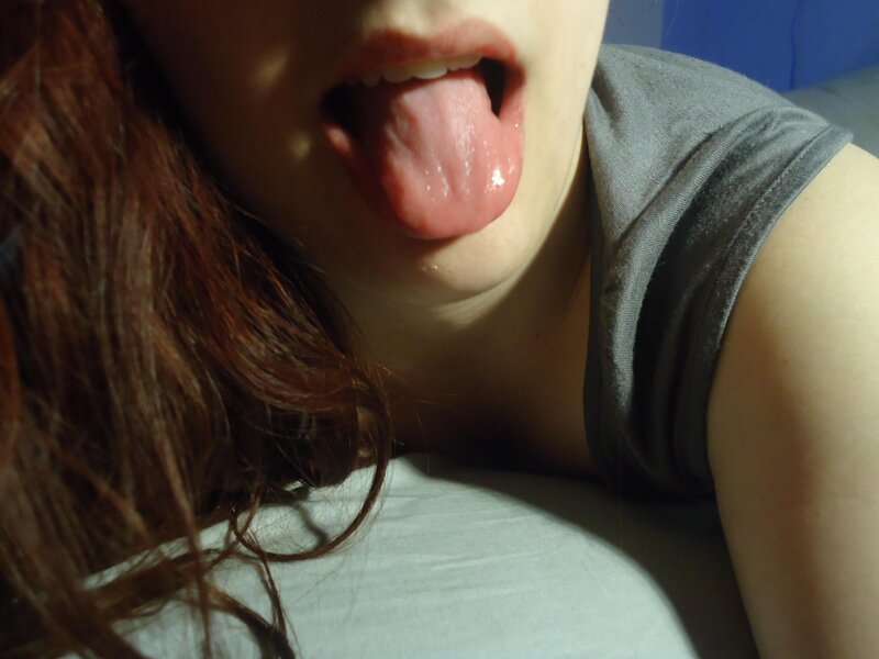 person sticking out tongue
