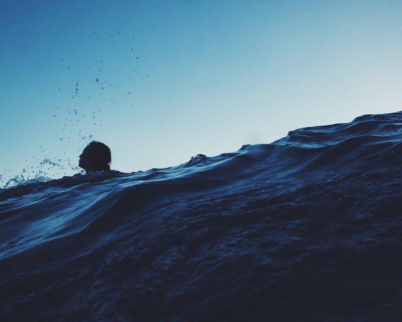 Person Swimming in Ocean — Blue, Calm, Sunset