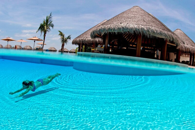 Person Swimming in Pool
