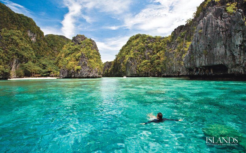Person Swimming in Turquoise Water