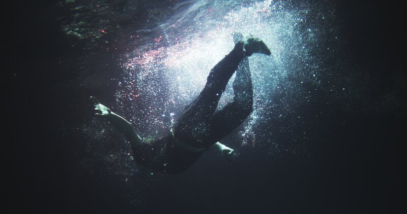 Person Swimming Underwater — Black