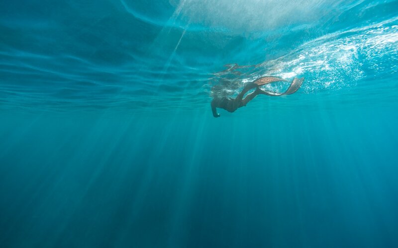 Person Swimming Underwater — Blue, Serene
