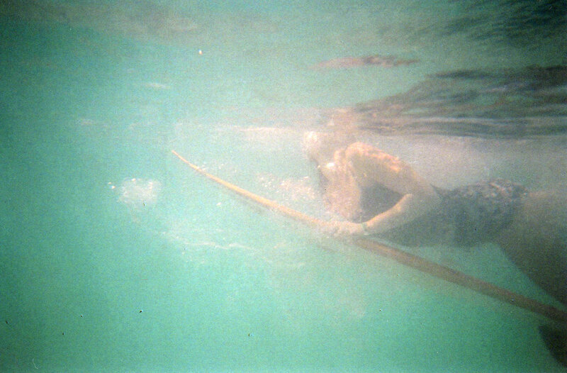 person swimming underwater