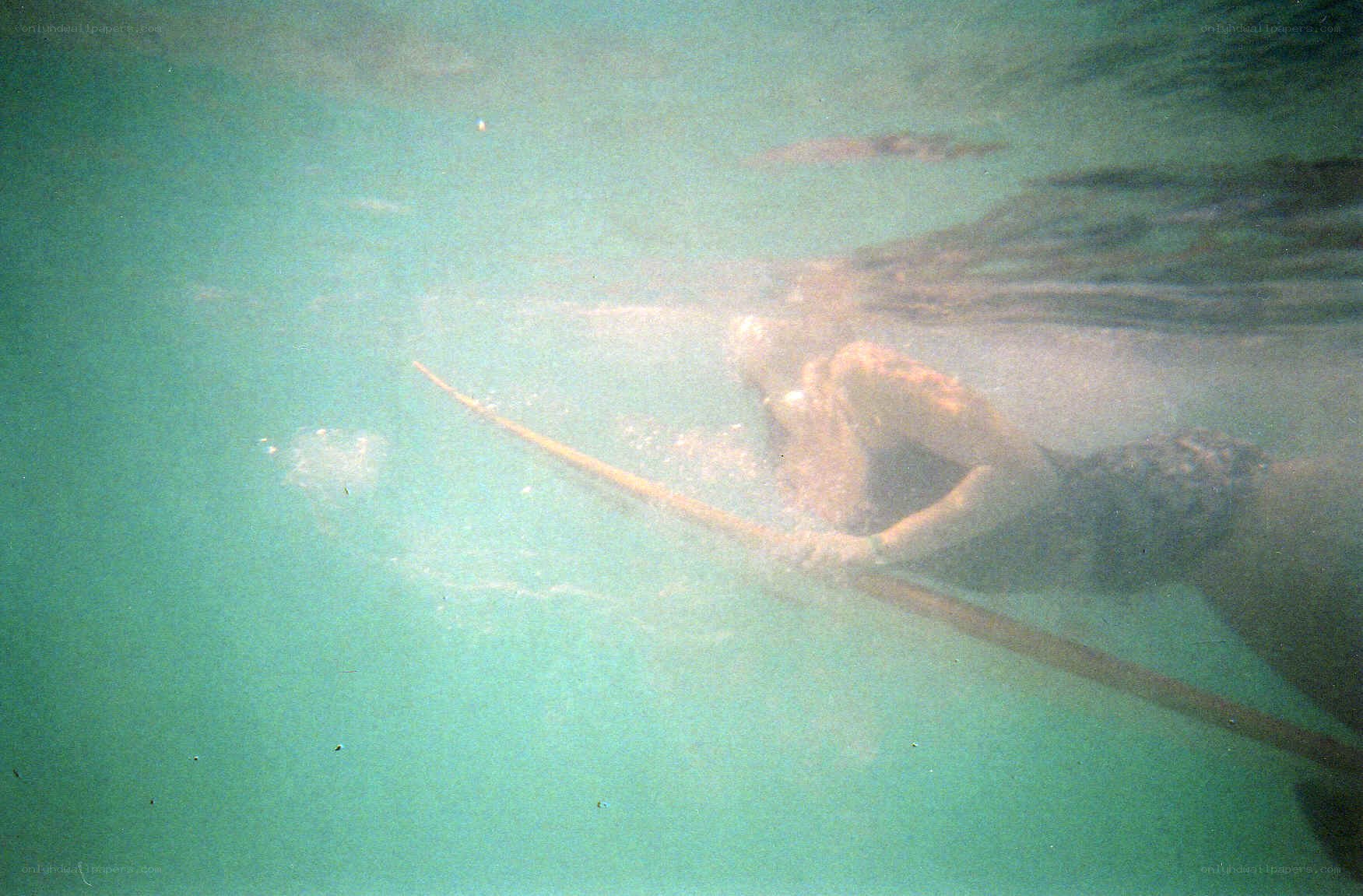 person swimming underwater