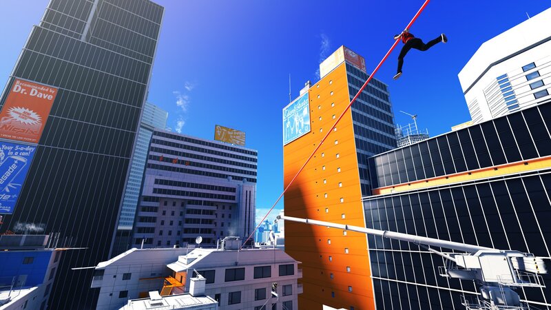 Person swinging on a rope in city