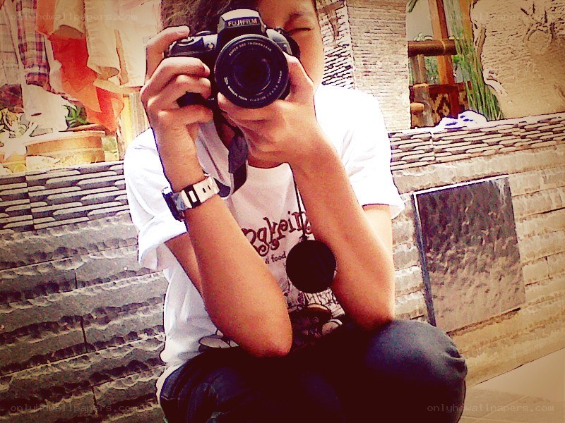person taking a photo with camera
