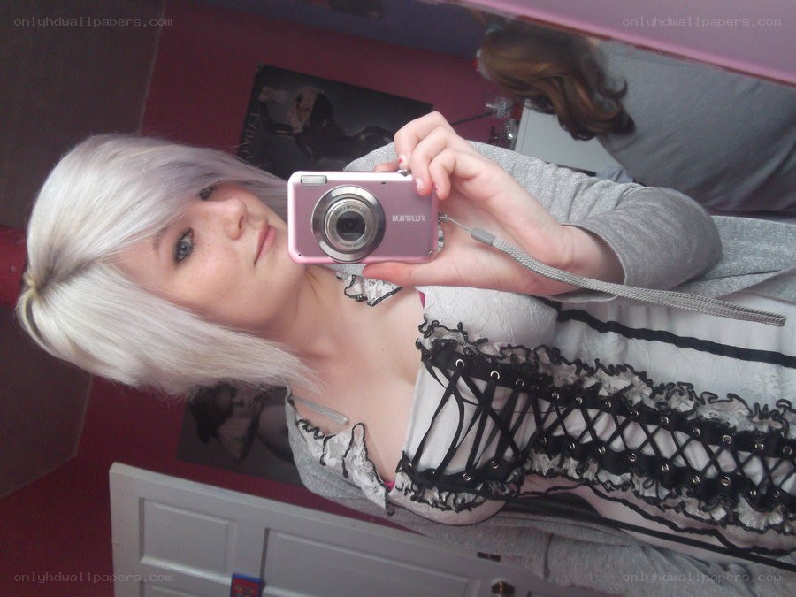 person taking mirror selfie