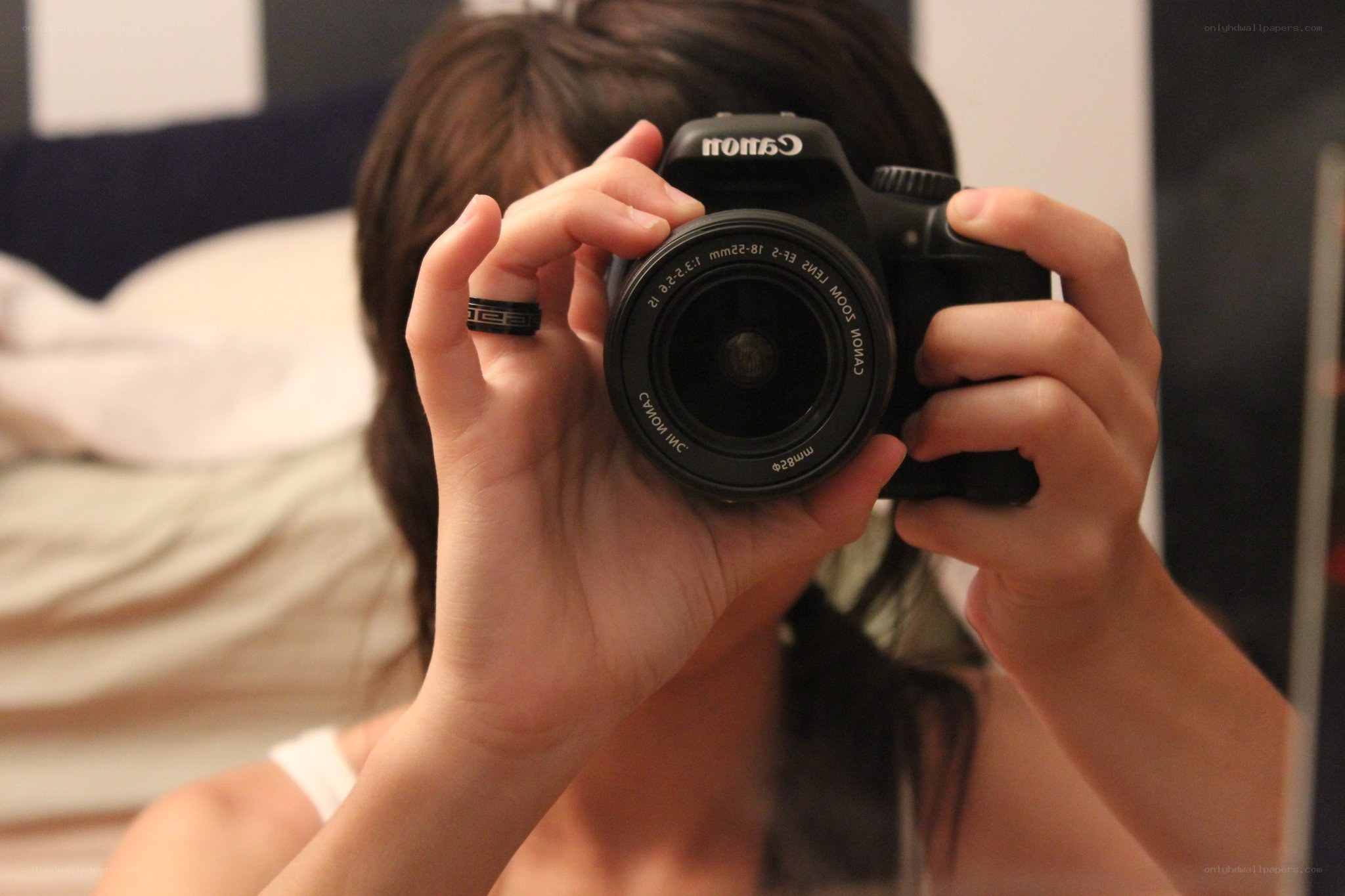 person taking mirror selfie with camera