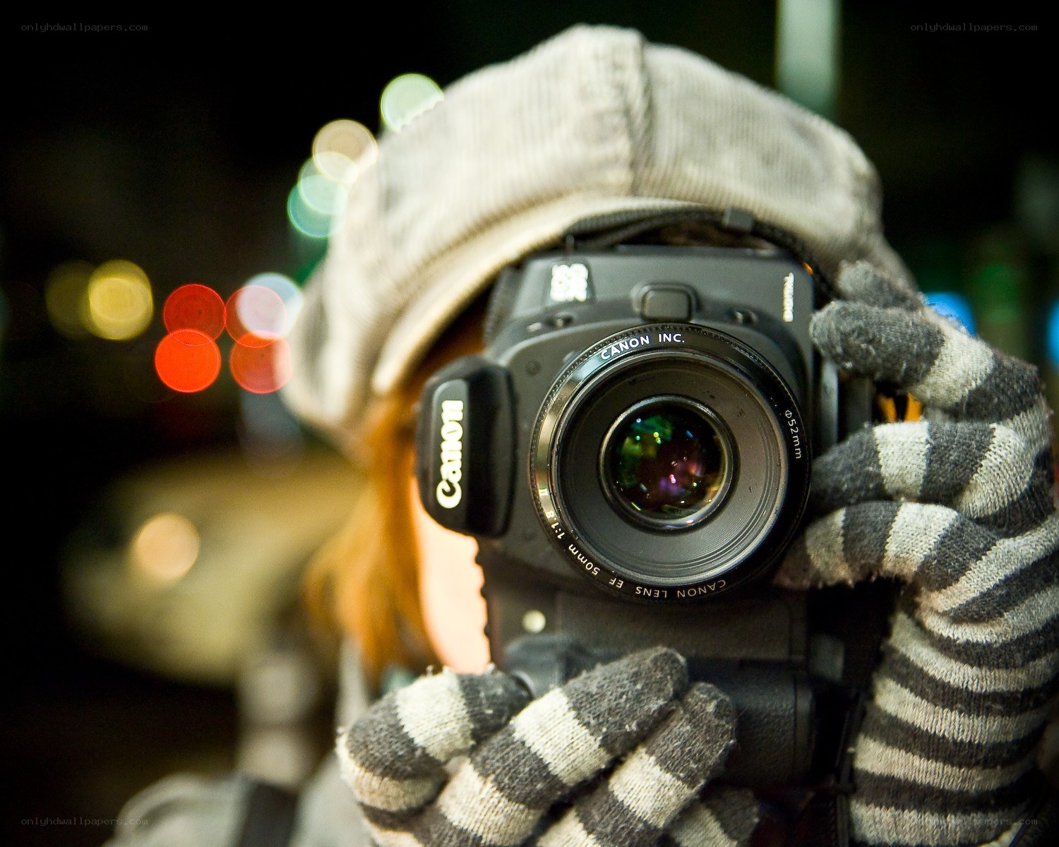 person taking photo at night