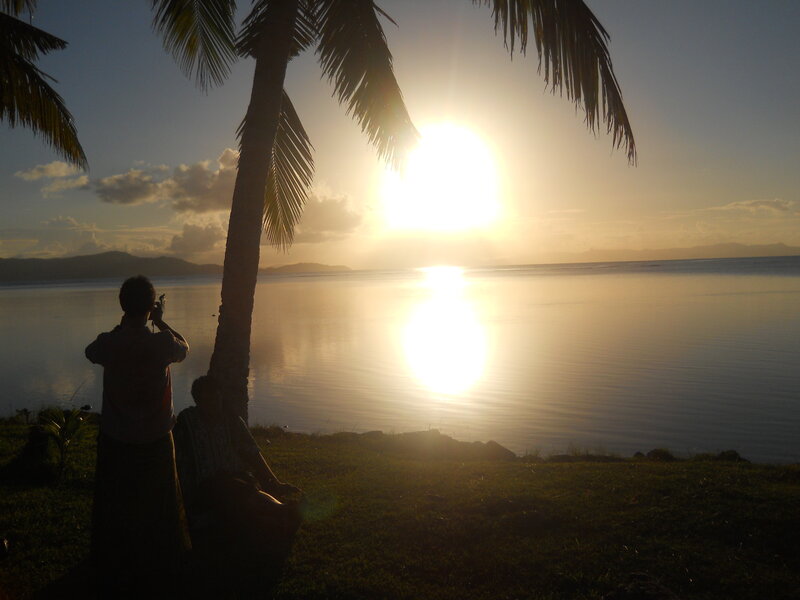 Person Taking Photo at Sunset