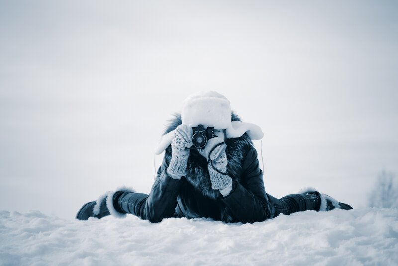 Person Taking Photo in Snow — White