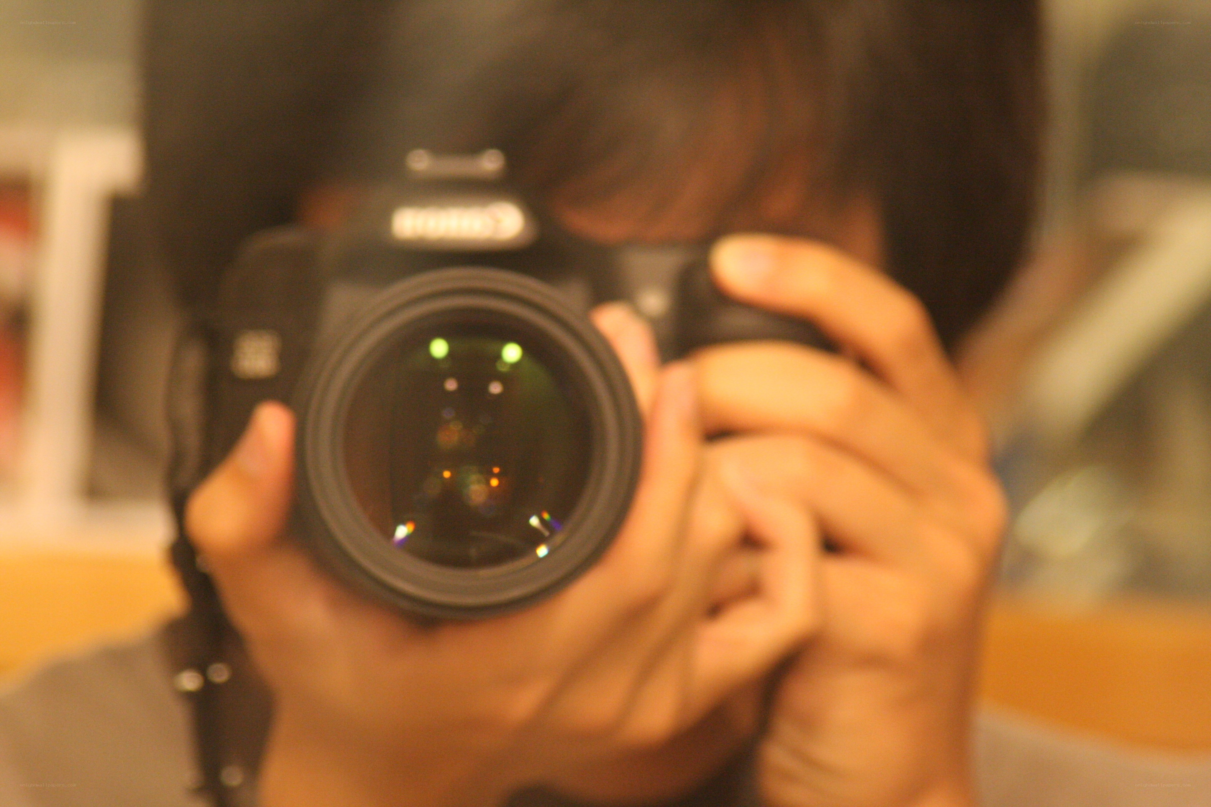 person taking photo with camera