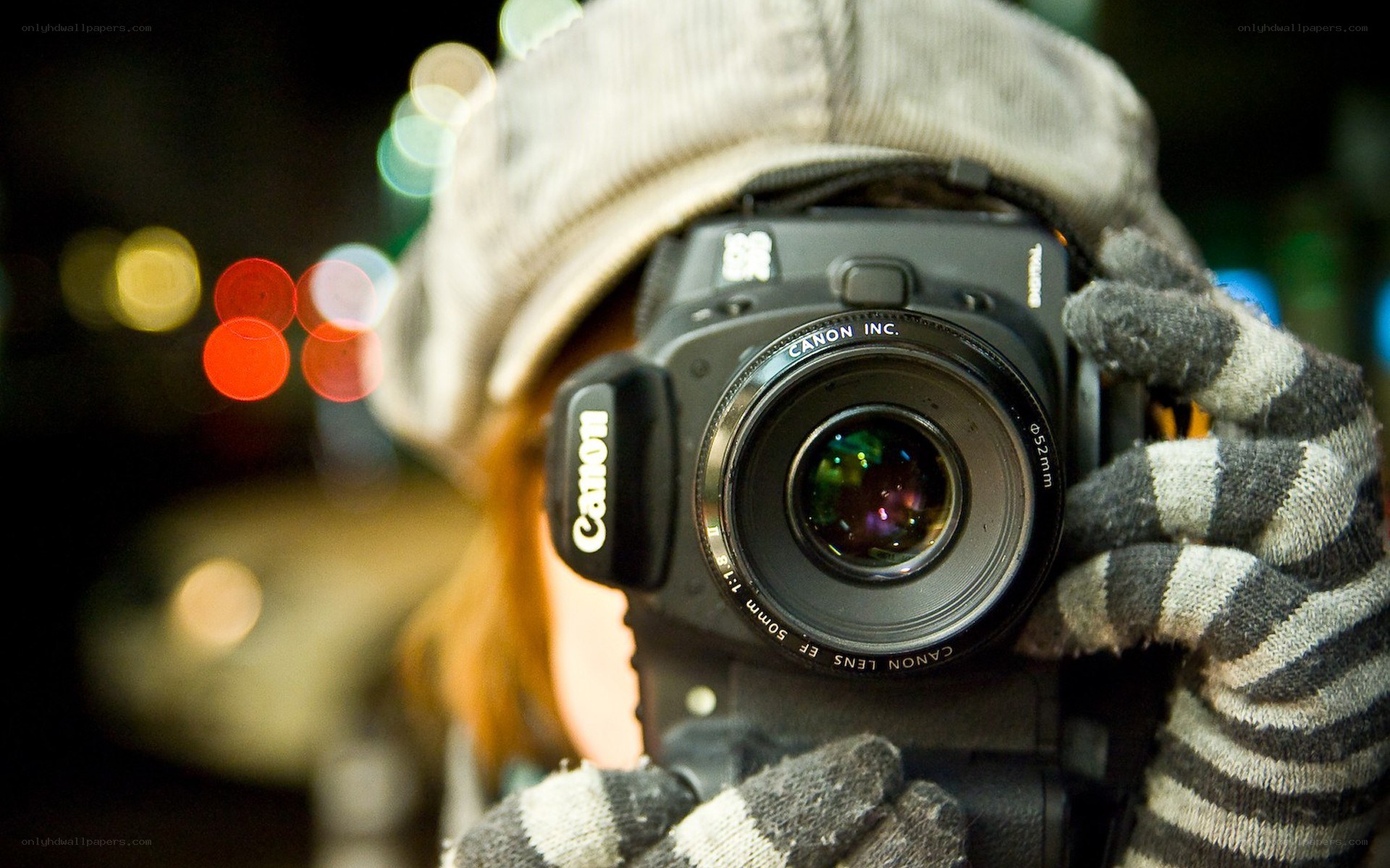 person taking photo with canon camera