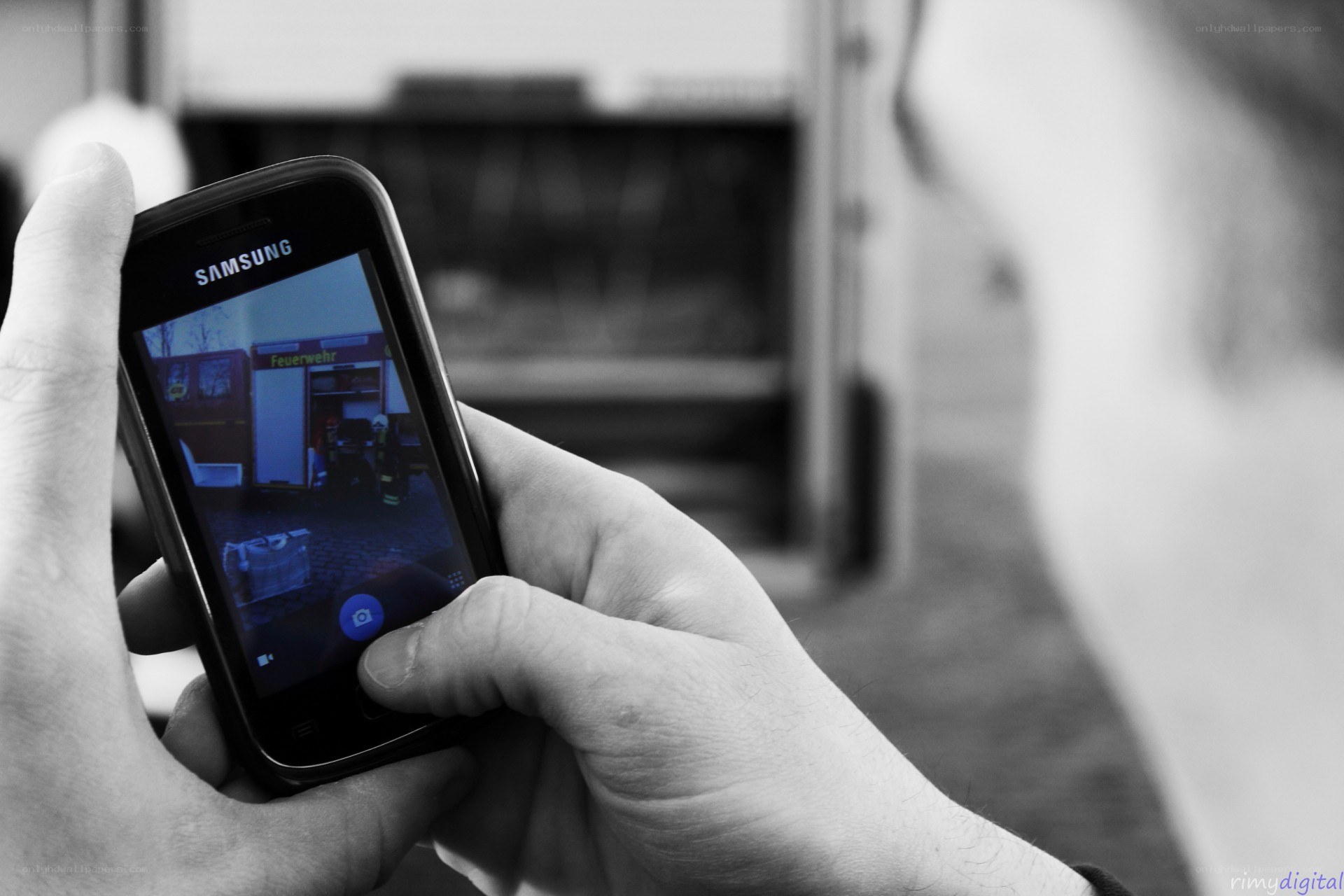 person taking photo with phone