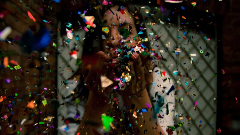 person throwing confetti