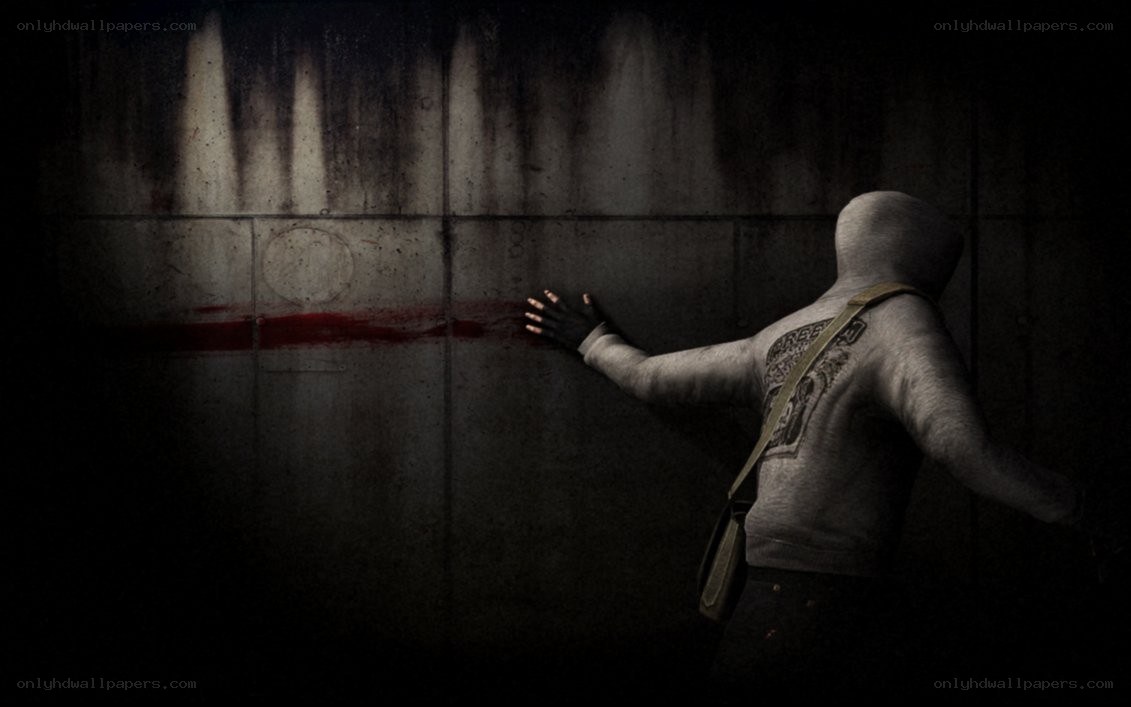 person touching blood-stained wall