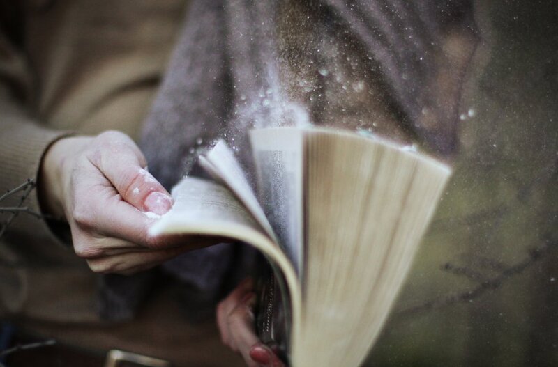 Person Turning Book Pages