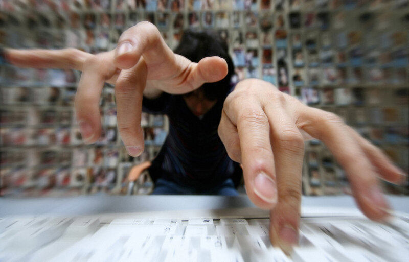 Person typing on keyboard