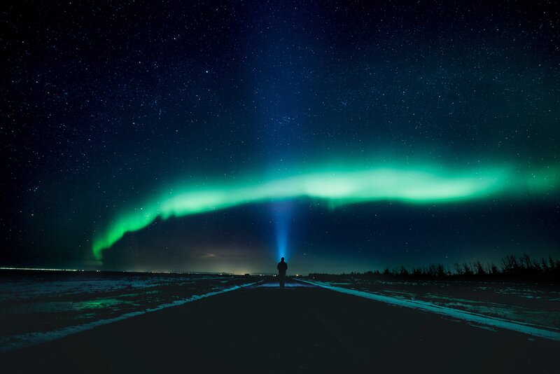Person under Aurora Borealis — Green