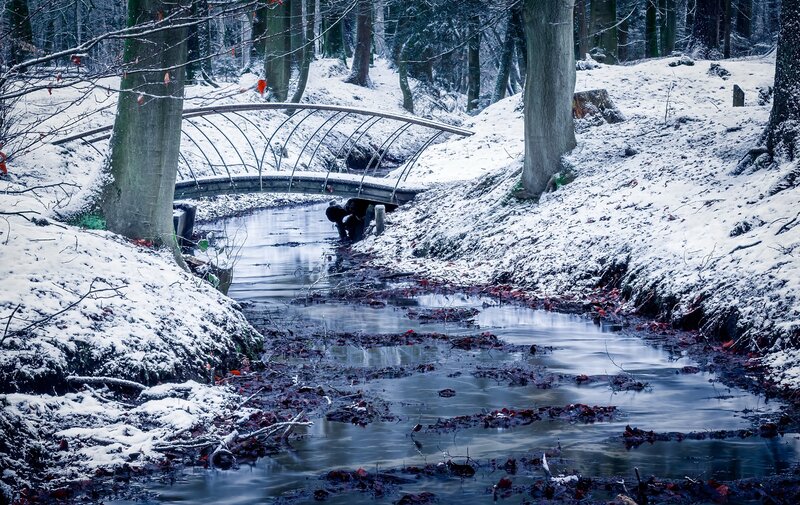 Person under Bridge in Snow