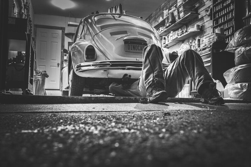 Person under Car