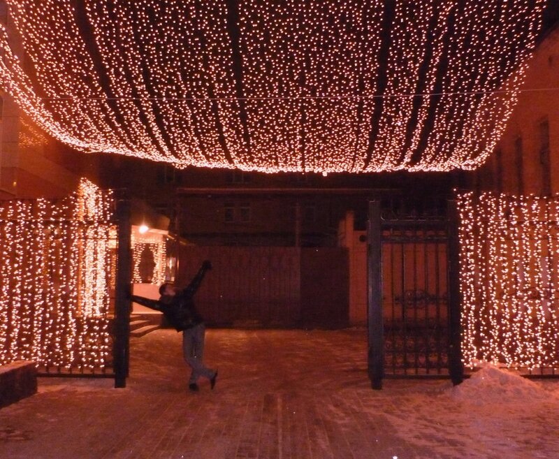 Person under festive lights
