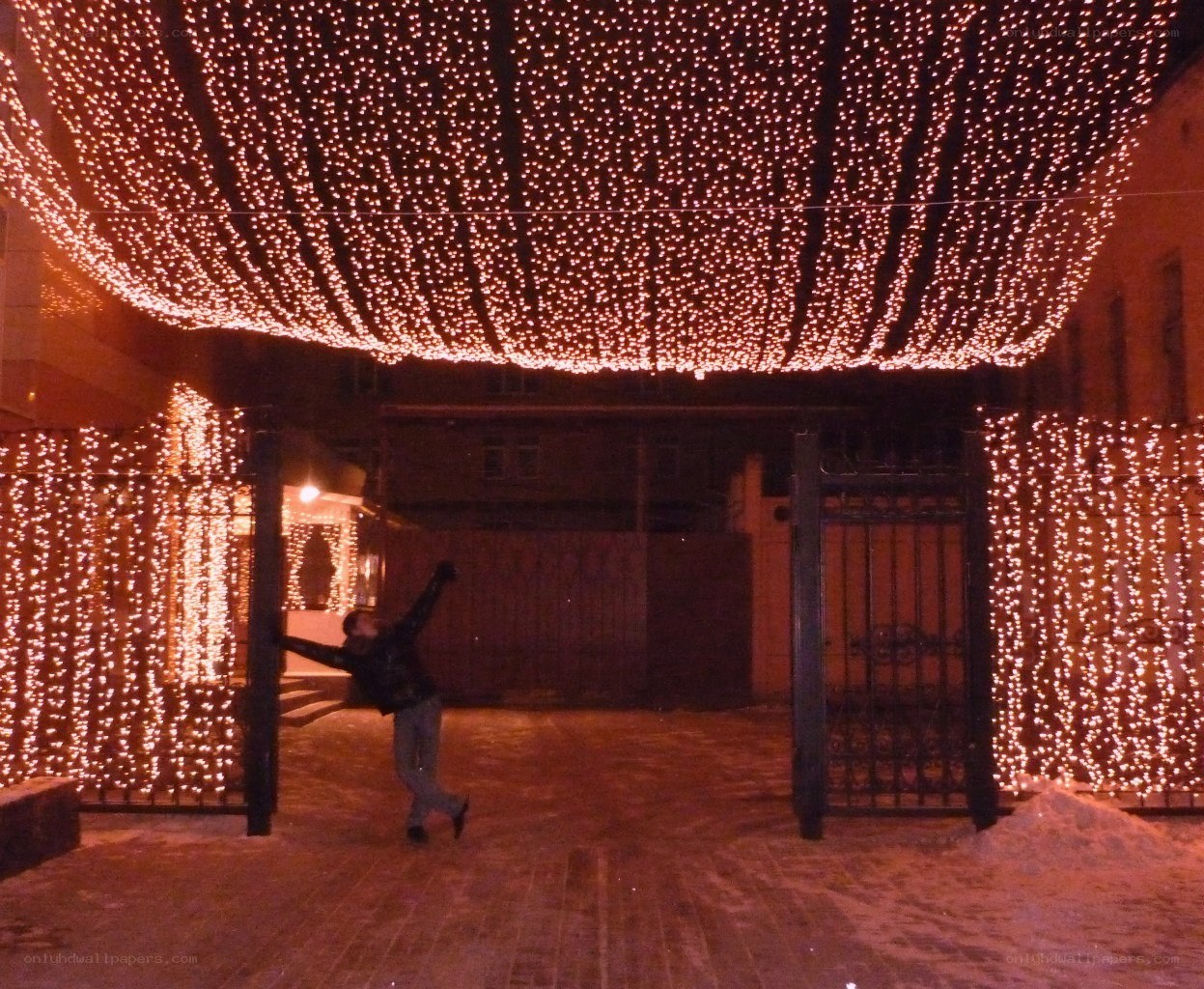 Person under festive lights
