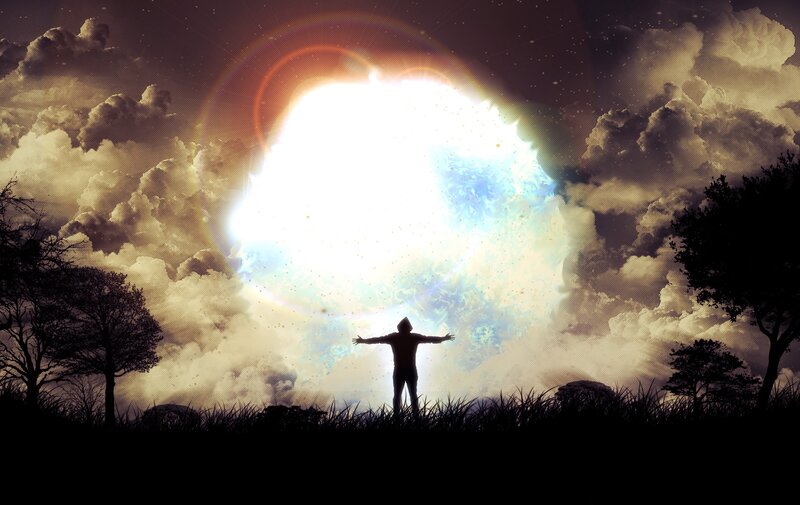 person under glowing sky