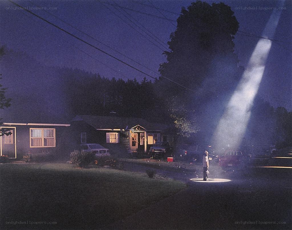 Person under spotlight at night