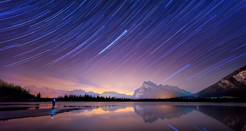 Person under Star Trails