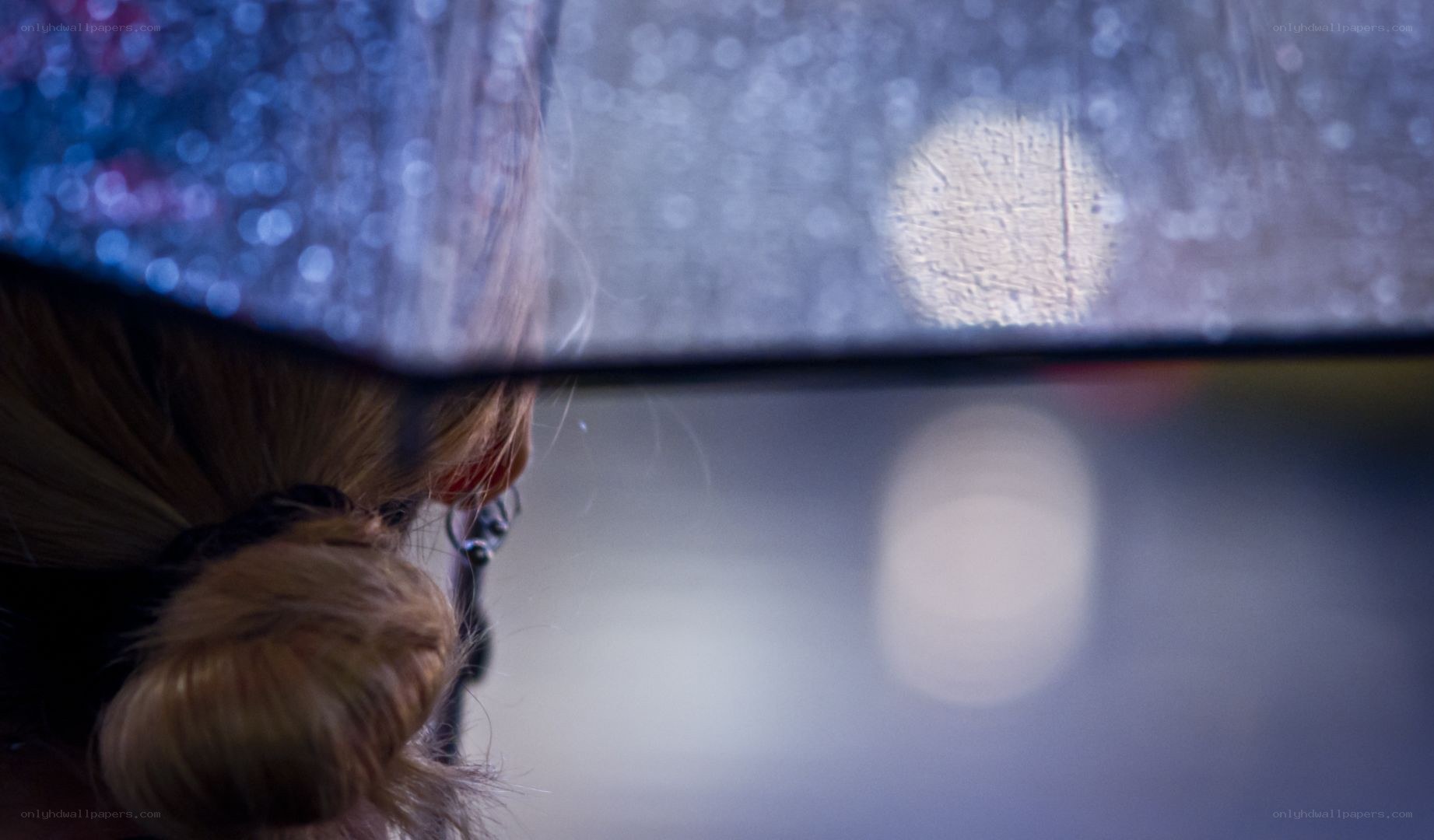 person under umbrella at night