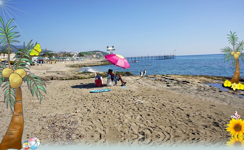 Person under Umbrella on Beach