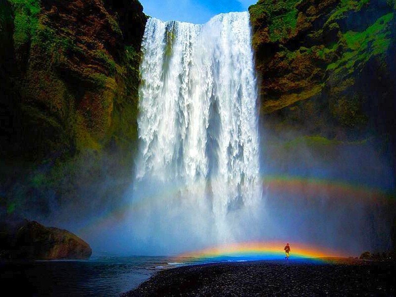 Person under Waterfall — Blue
