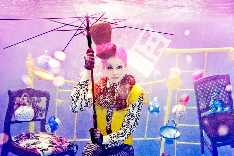 Person Underwater with Umbrella