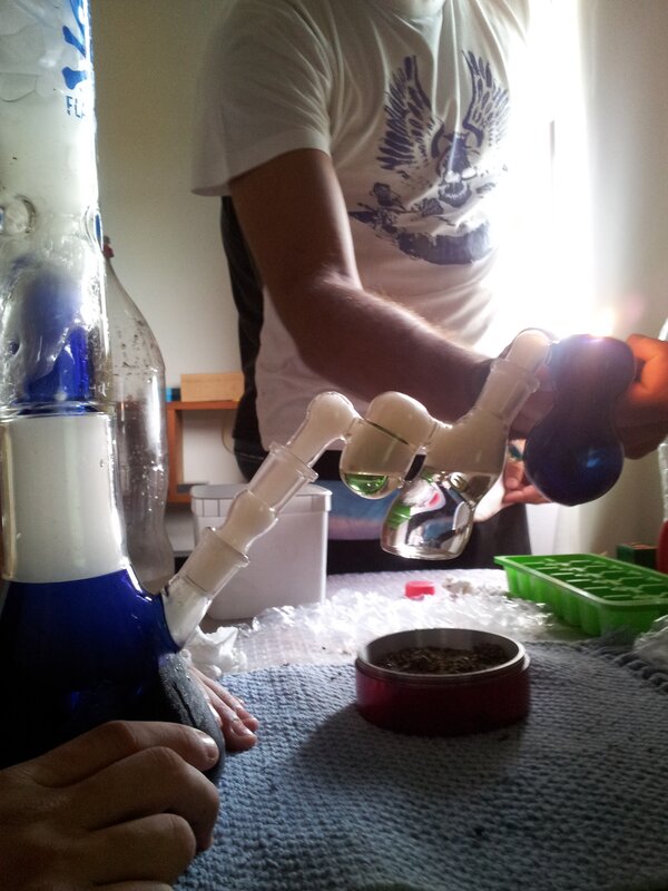 person using a glass bong