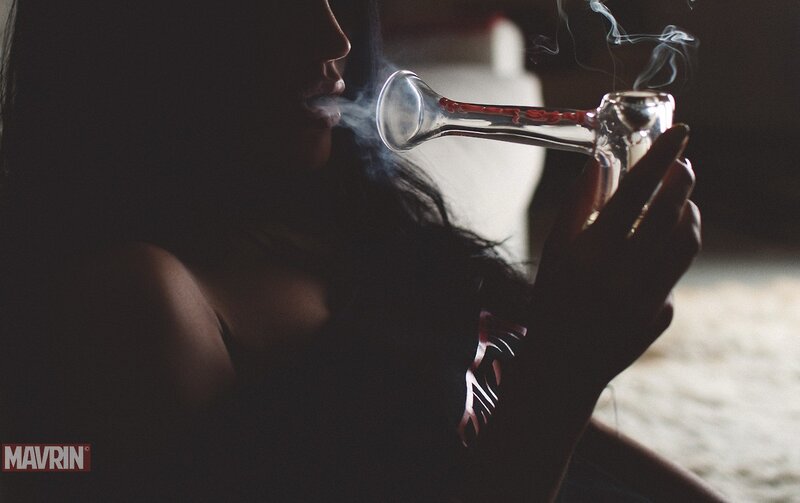 person using a glass pipe