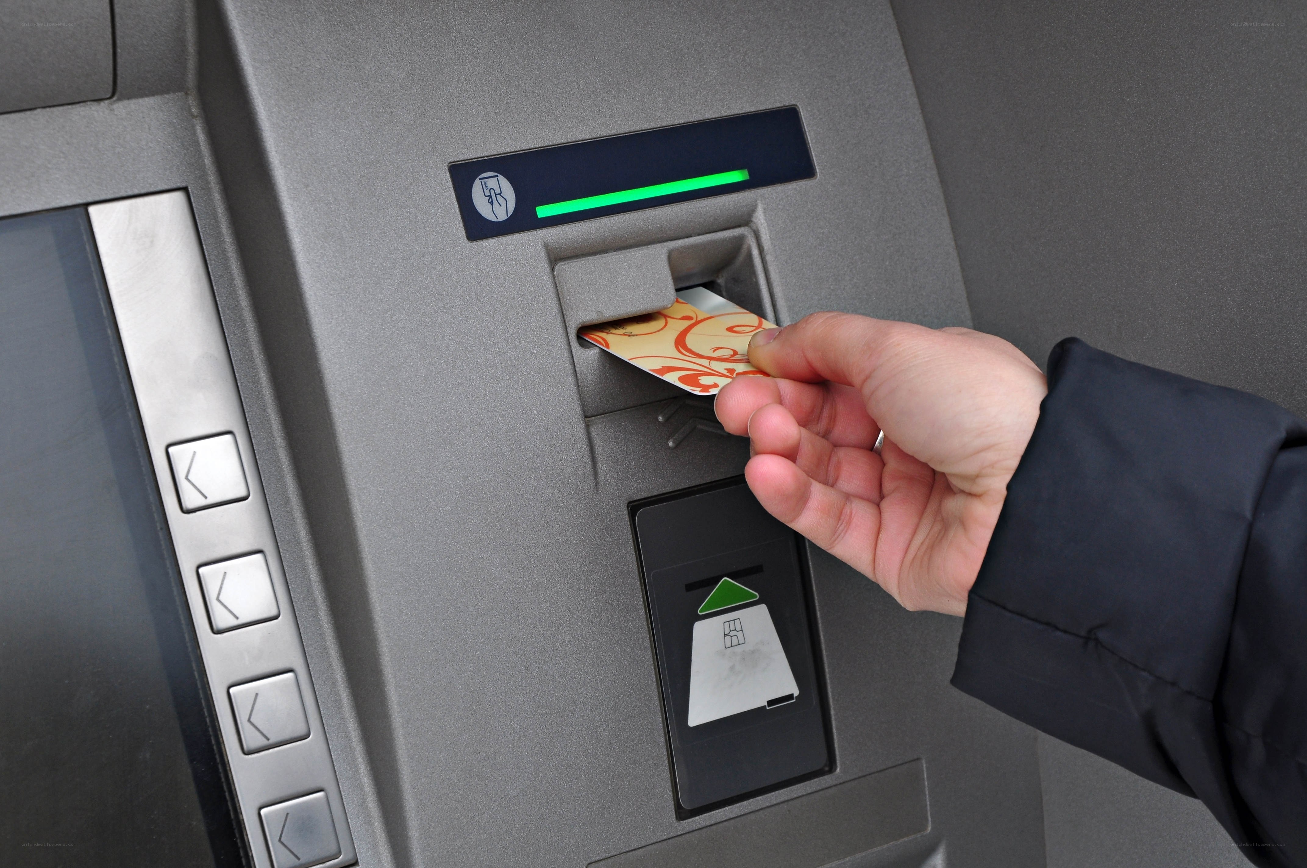 Person using ATM machine