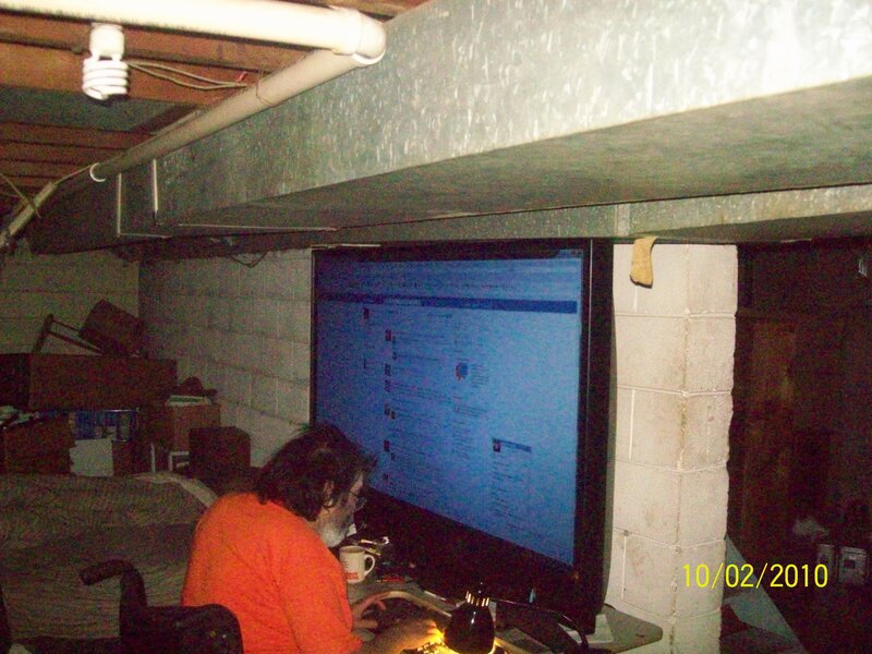 Person Using Computer — Orange