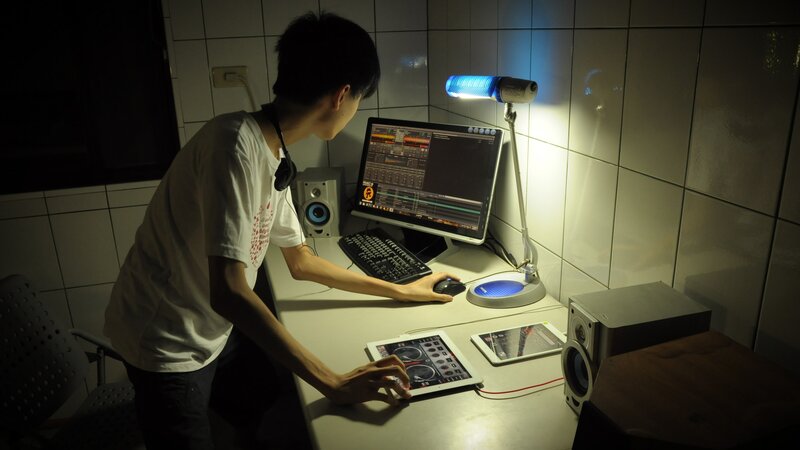 person using dj software at desk