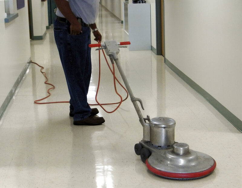 Person using floor buffer
