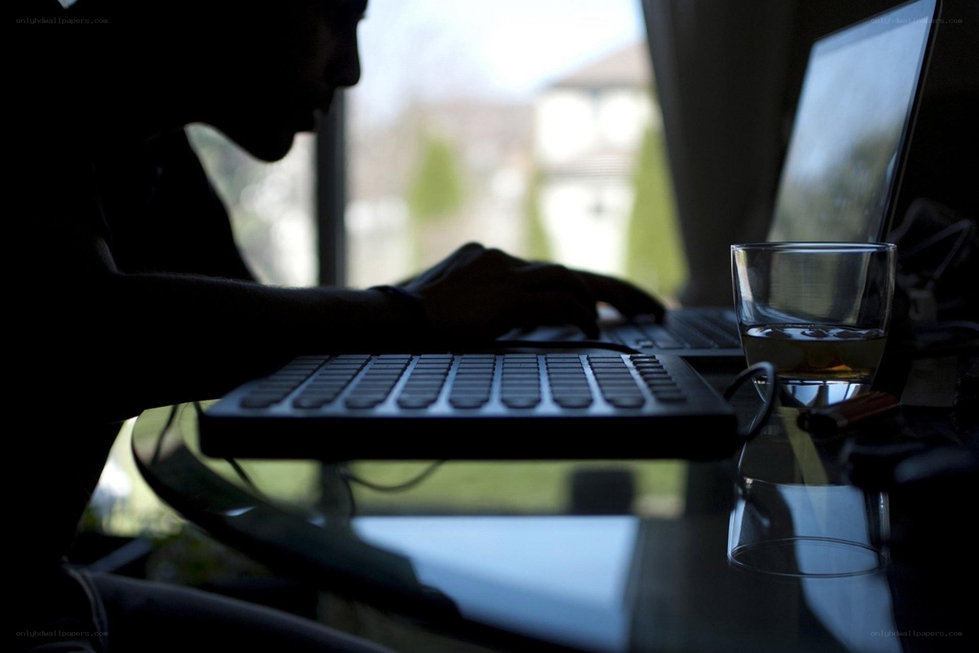person using laptop at desk